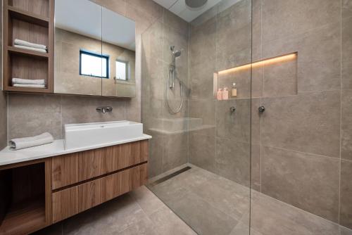 a bathroom with a shower and a sink at Sandringham Sunshine Escape in Sandringham