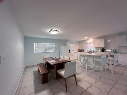 a kitchen with a table and chairs and a dining room at Water Front House in Providenciales