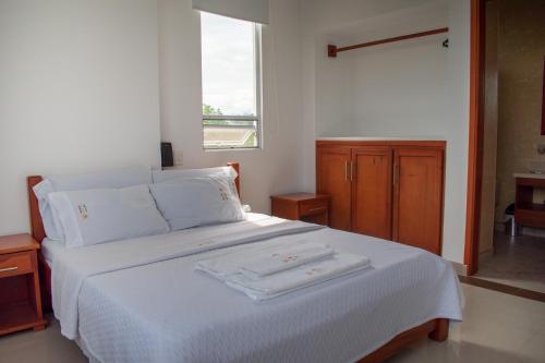 Postel nebo postele na pokoji v ubytování Hotel Rio Humadea