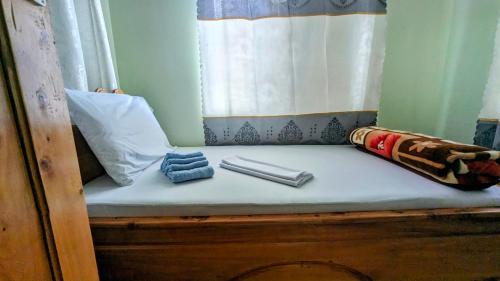 Łóżko lub łóżka w pokoju w obiekcie Galapagos Homestay