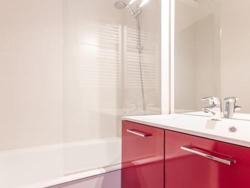 a bathroom with a red sink and a shower at Studio La Plagne Montalbert , 1 pièce, 5 personnes - FR-1-181-2468 in Aime-La Plagne