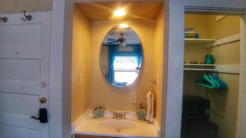 a bathroom with a sink and a mirror at The Chadwick in San Diego