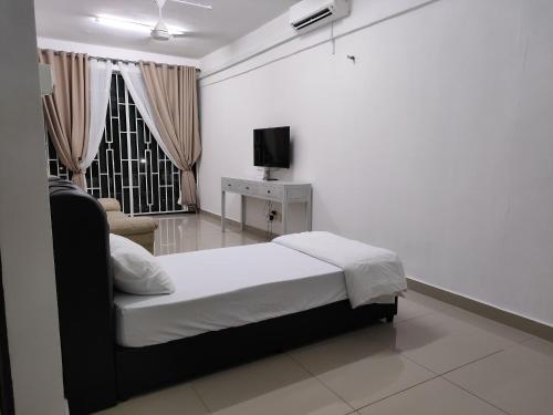 Postel nebo postele na pokoji v ubytování Homestay Studio Apartment Bentara Suite, Kompleks Mutiara Gua Musang