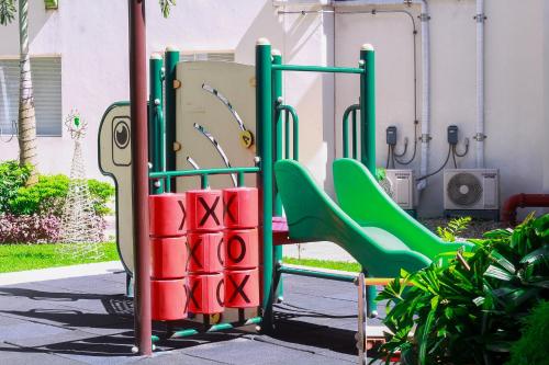 a playground with green and red slides at Affordable Condo beside Ayala Mall Bacolod! in Bacolod