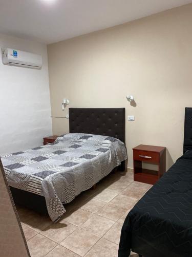 Katil atau katil-katil dalam bilik di Departamento Genaro