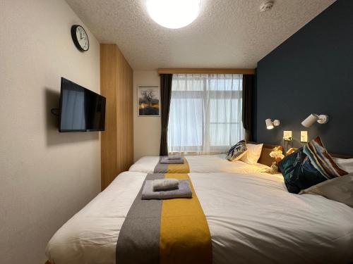 Кровать или кровати в номере nestay villa tokyo akihabara