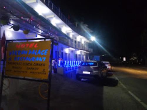 a truck parked next to a building at night at Hotel Vikram Palace Sapeta in Barkot