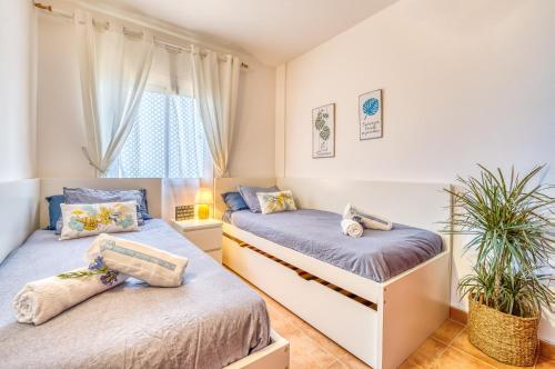 Ένα ή περισσότερα κρεβάτια σε δωμάτιο στο Ideal Property Mallorca - Casa Maylin