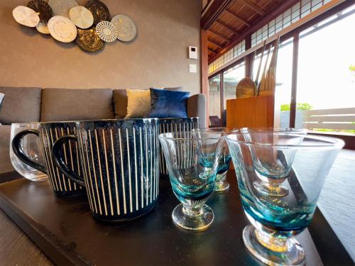 a table with three empty glasses on top of it at UMI-IRO〜うみいろ下関〜 in Shimonoseki
