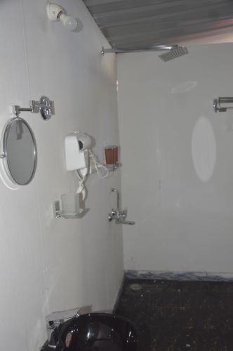 a bathroom with a sink and a mirror at SUNBATH beach EXOTICA in Canacona