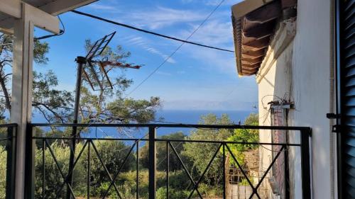 a balcony with a view of the ocean at Villa Korakades in Korakádes