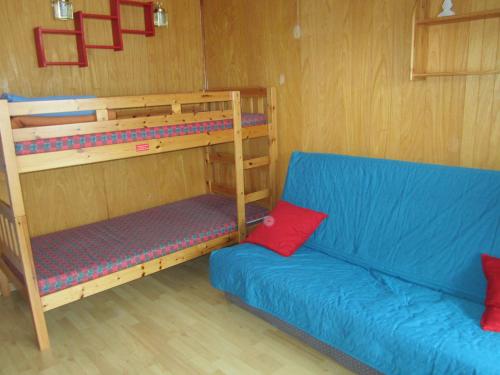 a living room with two bunk beds and a couch at Appartement Villard-de-Lans, 2 pièces, 6 personnes - FR-1-689-129 in Villard-de-Lans