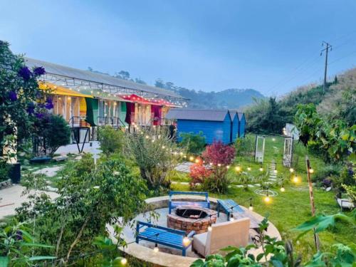 a garden with a fire pit in the yard at Nhà Trong Sương Đà Lạt in Da Lat