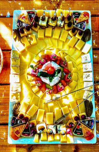 a plate of food on a wooden table at Villa Saturea in Boljevac