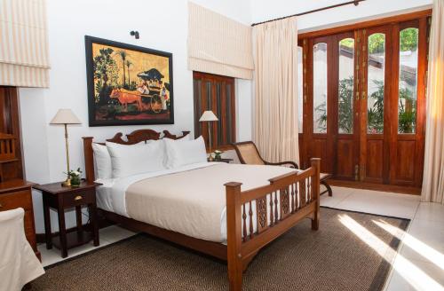 a bedroom with a large bed in a room at Nyne Hotels Landesi - Galle Fort in Galle