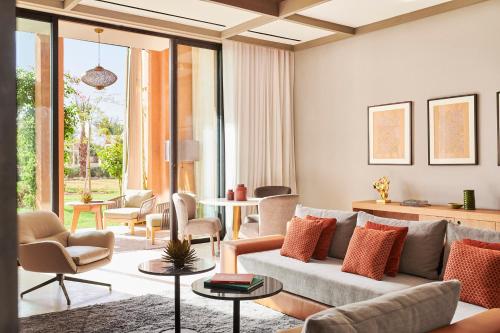 a living room with a couch and chairs at Park Hyatt Marrakech in Marrakech