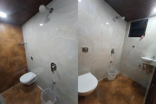a bathroom with a toilet and a sink at HOTEL MOON LITE RESIDENCY - Marve Road Malad West in Mumbai