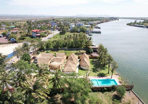 an aerial view of a resort next to a body of water at SEA SAND RESORT in Kampot