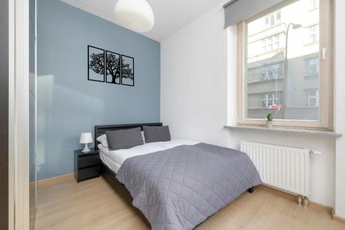Posteľ alebo postele v izbe v ubytovaní Lea Apartments Kraków Krowodrza by Noclegi Renters