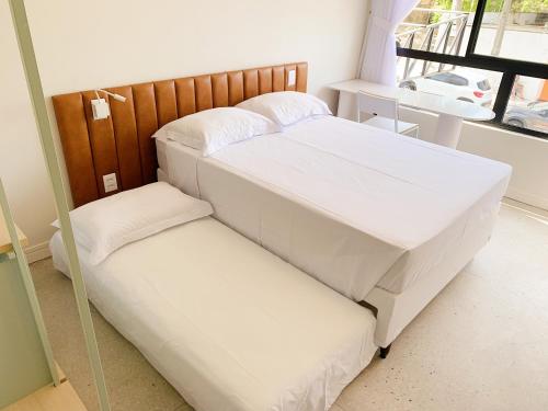 two beds sitting next to each other in a room at Liiv Hub in Natal
