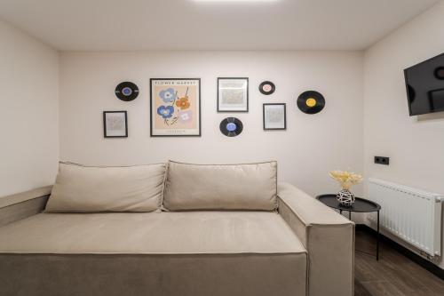 a living room with a couch and a table at 77 views apartments by INSHI in Lviv