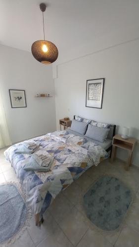 Postel nebo postele na pokoji v ubytování TasoulaSHome