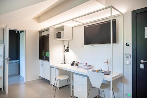Una televisión o centro de entretenimiento en Camplus San Pietro - Casa per ferie