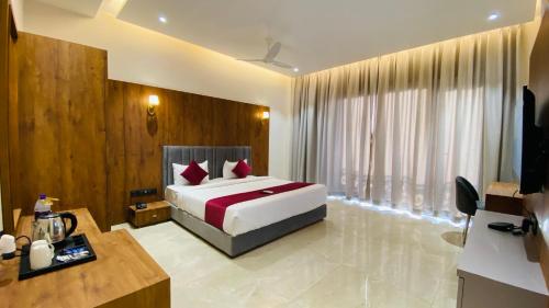 Postel nebo postele na pokoji v ubytování Gaurison Hotel and Resorts