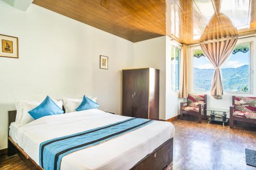 Ένα ή περισσότερα κρεβάτια σε δωμάτιο στο Hotel Blue Poppy