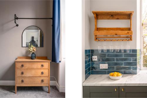 ein Badezimmer mit einer Kommode und einem Spiegel in der Unterkunft Vibrant Leith Flat in Edinburgh