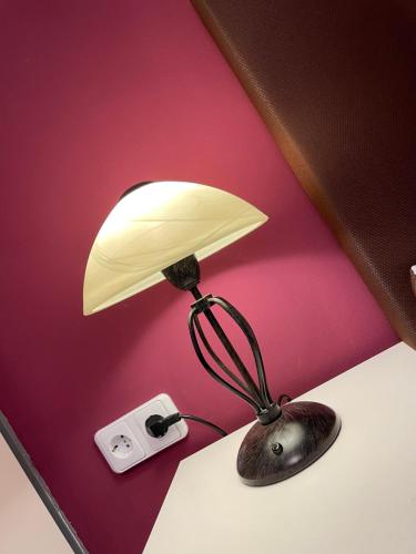 a lamp sitting on a desk next to a wall at Cochemer Arkaden in Cochem