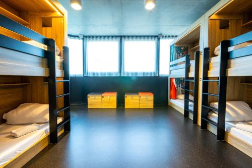 a room with four bunk beds in it at The People - Paris Marais in Paris