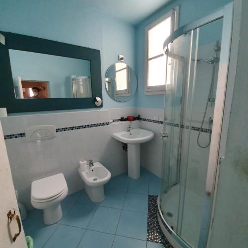 a bathroom with a sink and a toilet and a shower at Accademia Studio in Florence