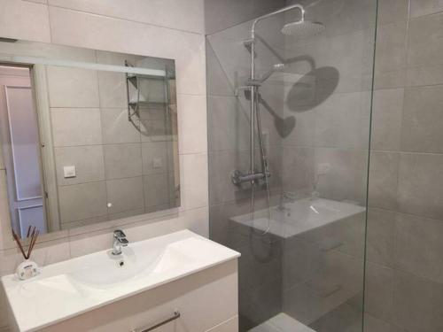 a bathroom with a sink and a shower and a mirror at Casa Sofia in Els Poblets in Els Poblets