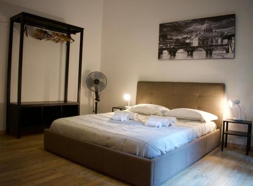 Giường trong phòng chung tại Lavinia Apartment In Trastevere