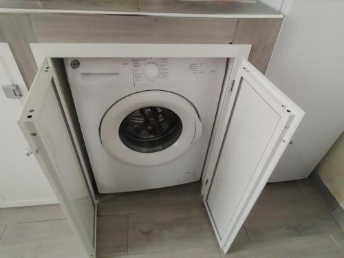 a white washer and dryer in a room at La casa di Teresa in Taranto