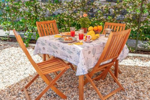a table with food and fruit on top of it at PORTOVECCHIO Plus in Levanto