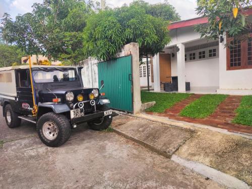 a jeep parked in front of a house at Araliya Uyana Residencies Colombo - Entire House with Two Bedrooms in Colombo