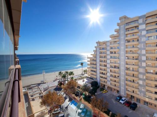 a view of a building and the beach at Apartment Topacio I by Interhome in Calpe