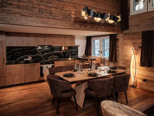 a dining room with a table and chairs at Apartment Kirchplatz by Interhome in Zermatt