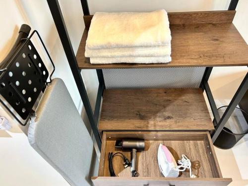 a wooden box with a sink and towels on a shelf at HCK14 A Sky Tree Dualkey Bukit Indah Aeon Legoland in Johor Bahru