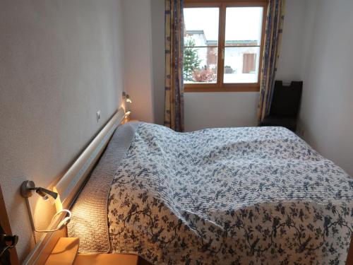 a bedroom with a bed with a blanket on it at Apartment Tga Stgirat Obergeschoss by Interhome in Malmigiuer