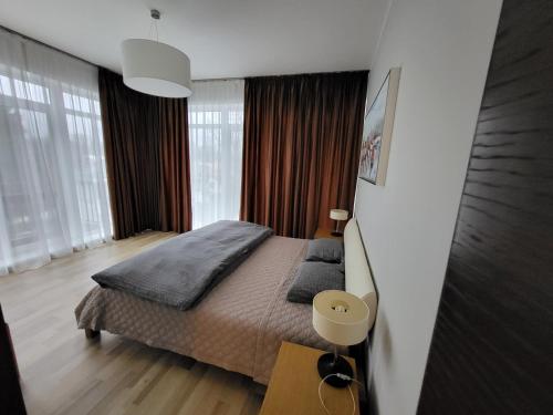 מיטה או מיטות בחדר ב-Квартира с двумя спальнями