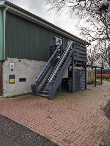 a stairway leading to a building with a door at Ferienwohnung Bornhöft in Burg