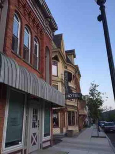 a building on a street with a street sign on it at The Cast Iron Lady in Wyalusing