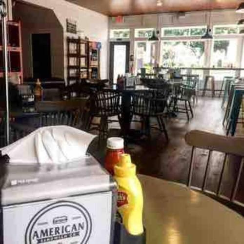 a table with a box of ketchup and mustard on it at The Cast Iron Lady in Wyalusing