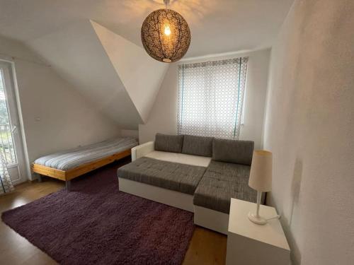 a living room with a couch and a bed at Villa Osik in Sarajevo
