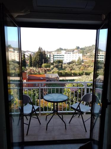 a balcony with two chairs and a table on a balcony at Apartment Seman in Vela Luka