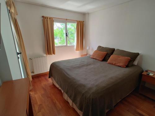 En eller flere senge i et værelse på Departamentos de Categoría, Santa Fé y Alberti