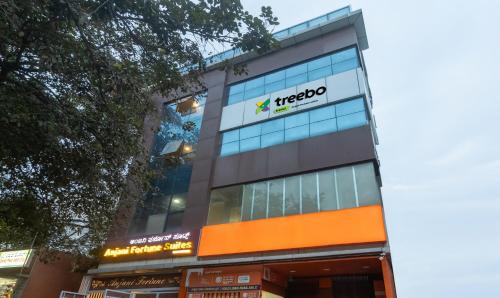 a building with a mexico sign on it at Treebo Anjani Fortune Suites in Bengaluru